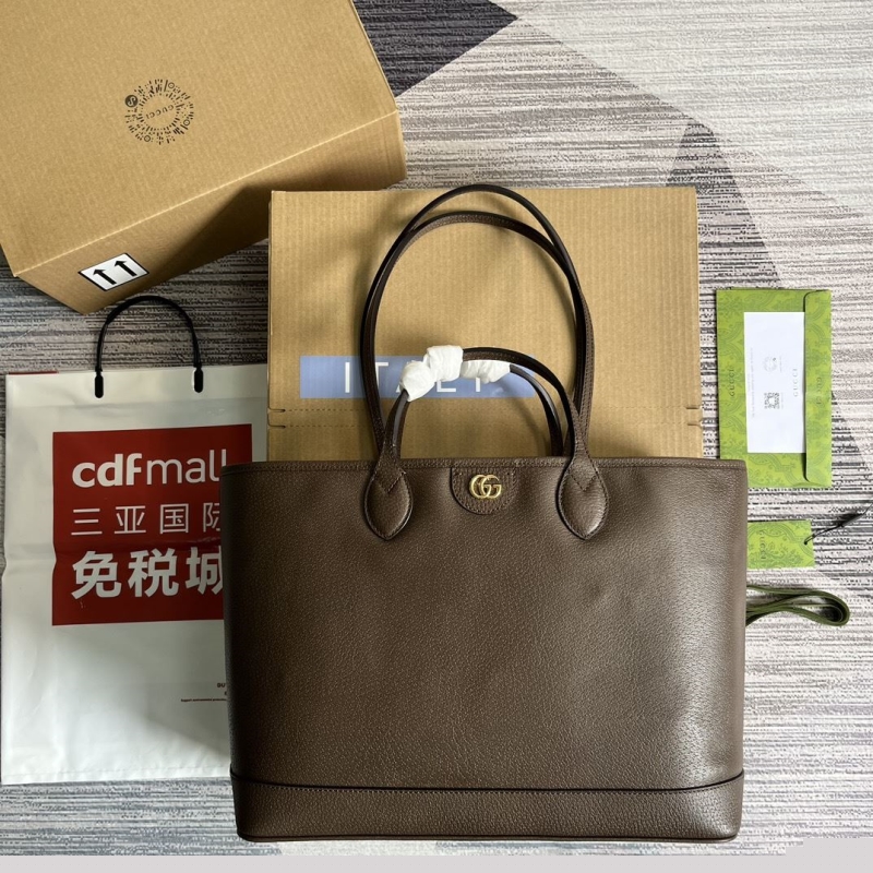 G*u*i shopping bags